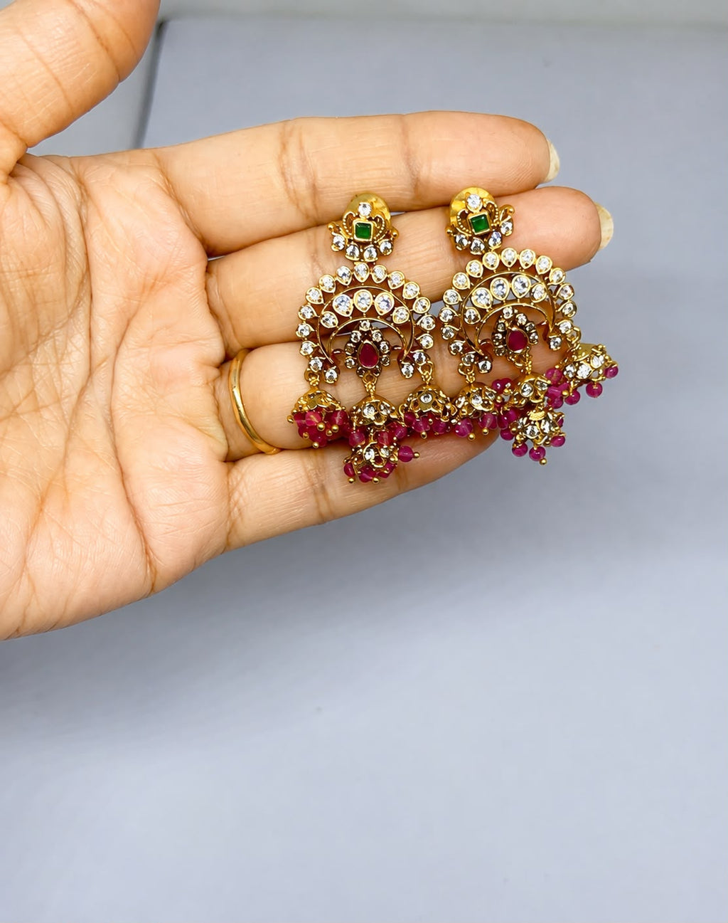 Gold-finish chandelier with maroon beads earrings