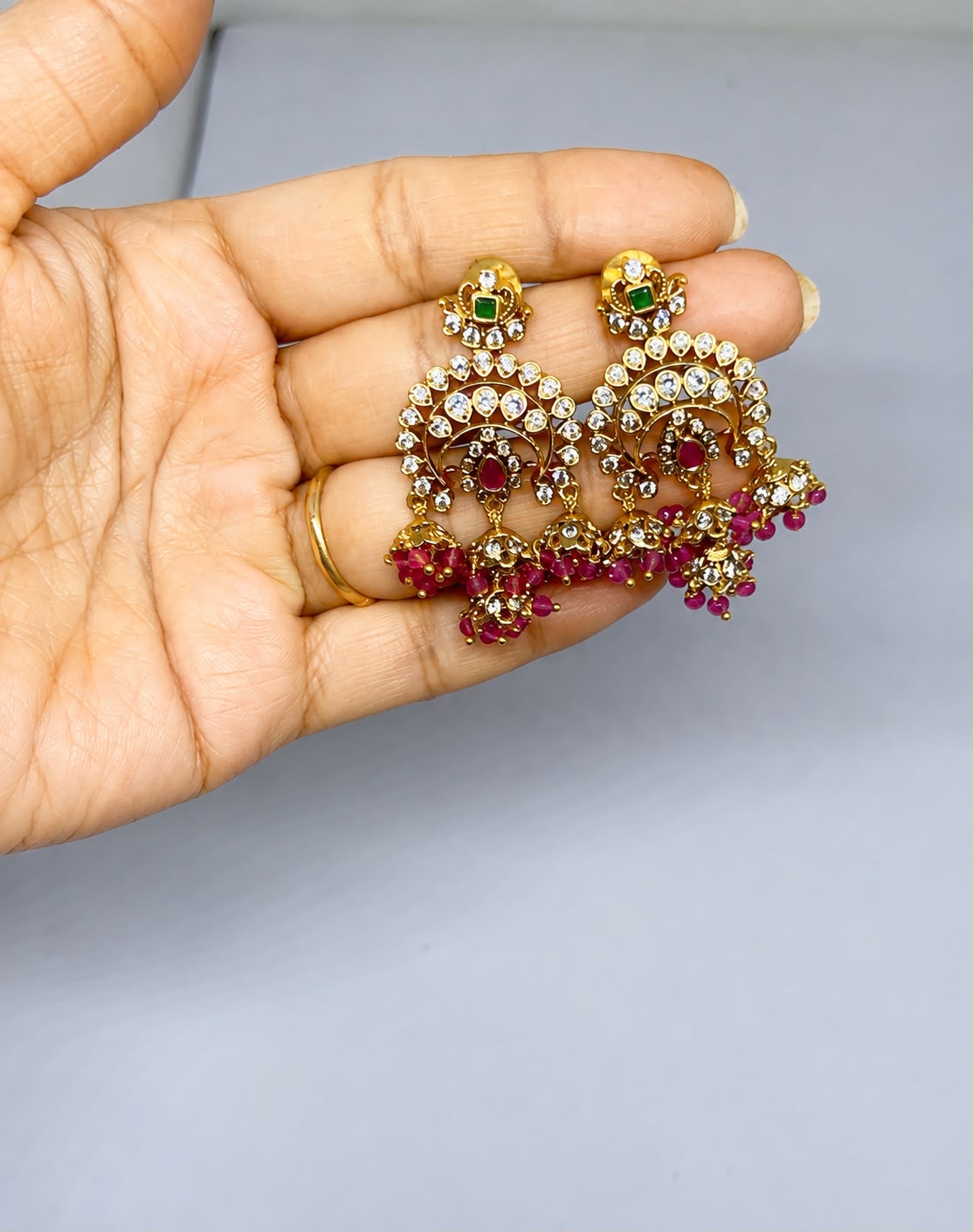 Gold-finish chandelier with maroon beads earrings
